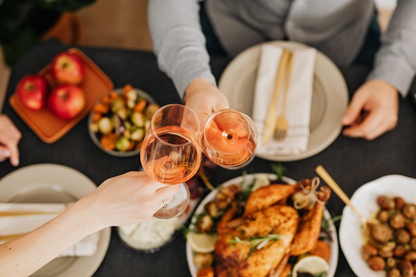 Couple toasting with wine before dinner